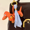 oranje teckel bag charm met lichtblauwe tassel - VERKOCHT