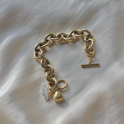 schakelarmband met hartje en vogel in parelmoer